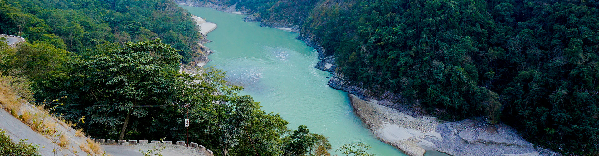 Jade-green river running through a steep forested gorge
